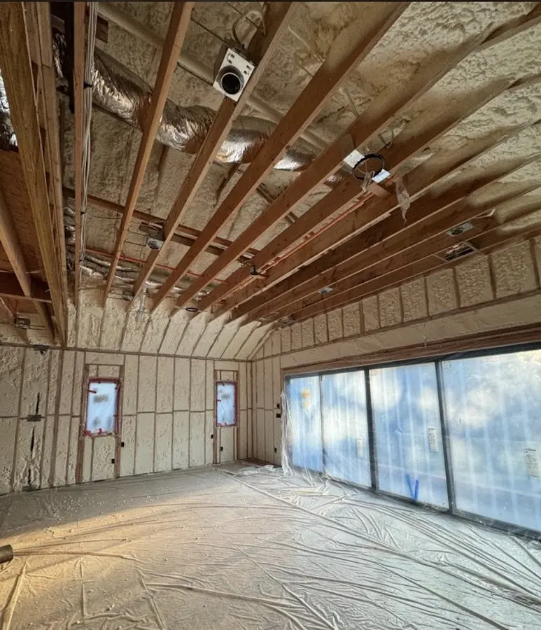 Interior walls and ceiling insulated with spray foam during new construction in Coventry